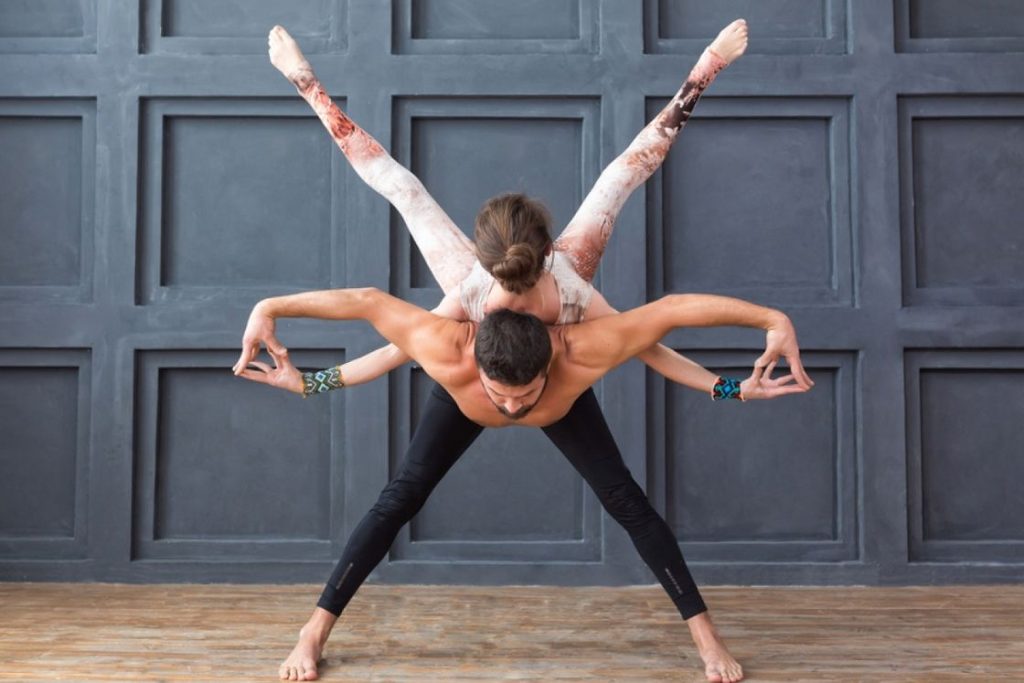 Man And Two Women Practicing Acro Yoga Exercises In Group Together Stock  Photo, Picture and Royalty Free Image. Image 58135182.